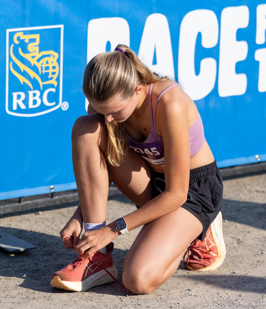 Participant tying her shoes.