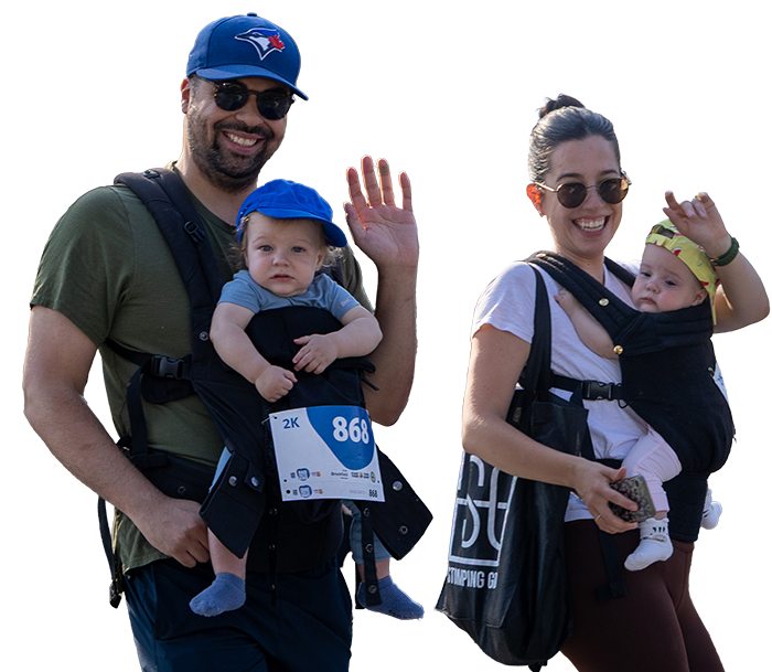 Parents and their children waving.